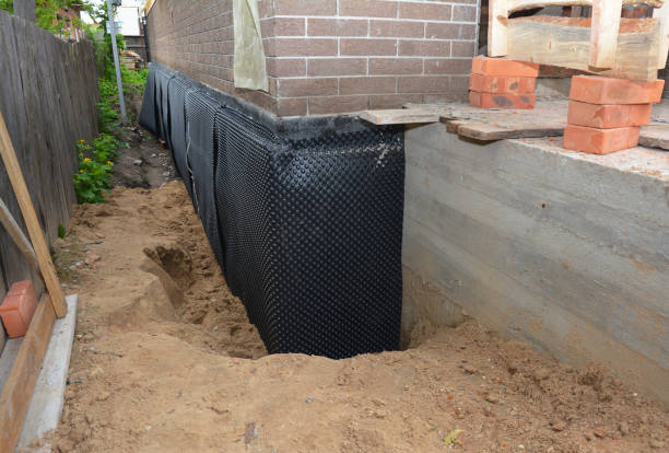 SJ Waterproofing Pros technician performing targeted Basement Waterproofing assessment in Egg Harbor City, NJ